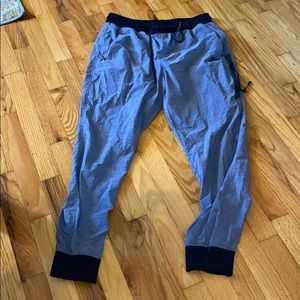 Grey Nike windbreaker joggers; size medium